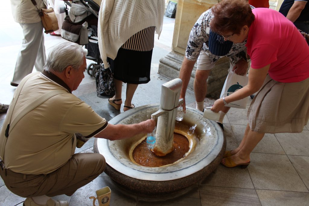 Karlovy Vary, people are drinking healing water